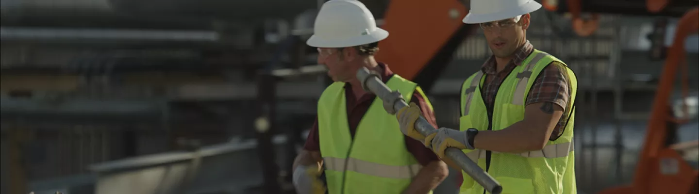 two men in hard hats on construction site