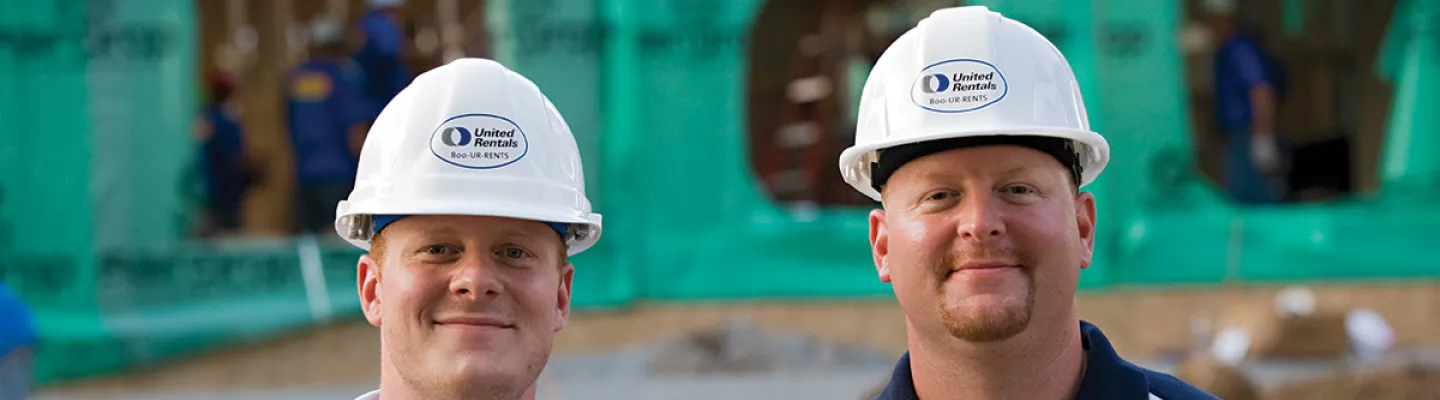 two men in hard hats on construction site