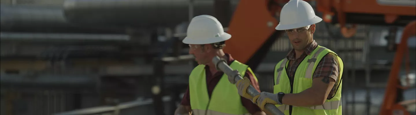 two men in hard hats on construction site