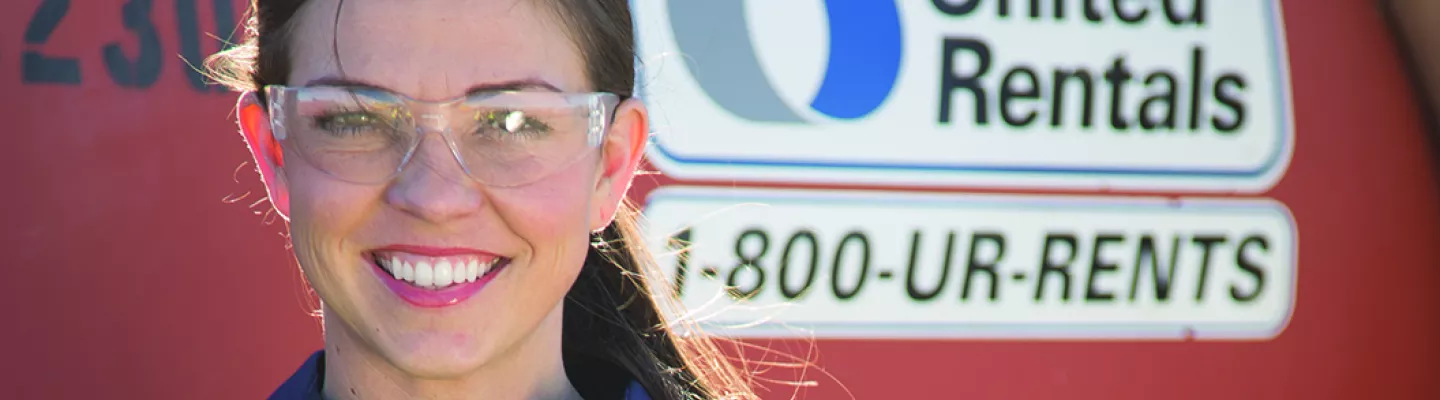 girl in ppe next to equipment