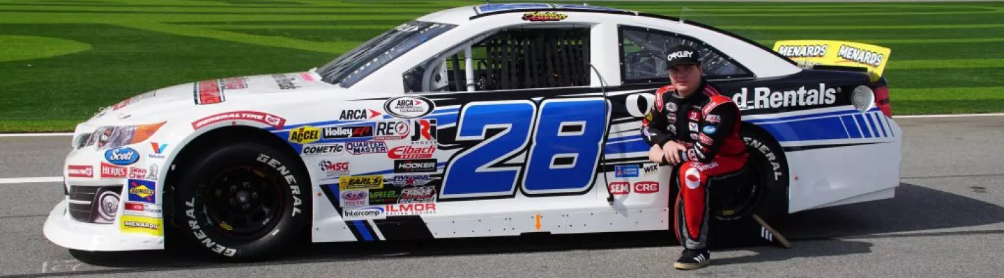 sheldon creed next to his car 