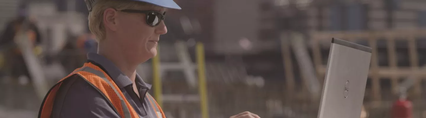woman on jobsite with laptop