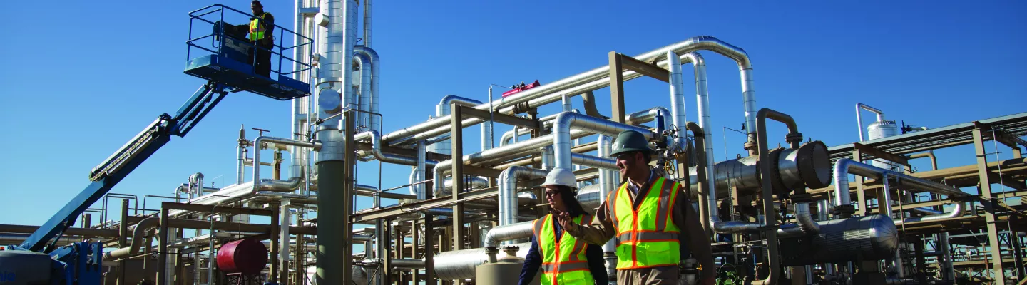 Construction managers in front of power plant