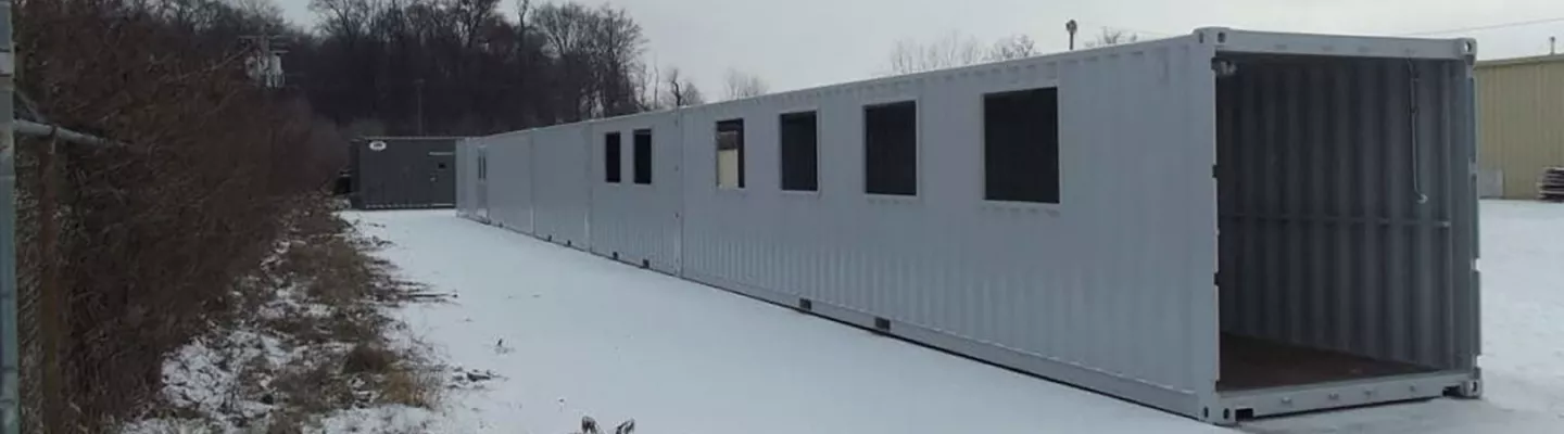 Container covered walkway in snow