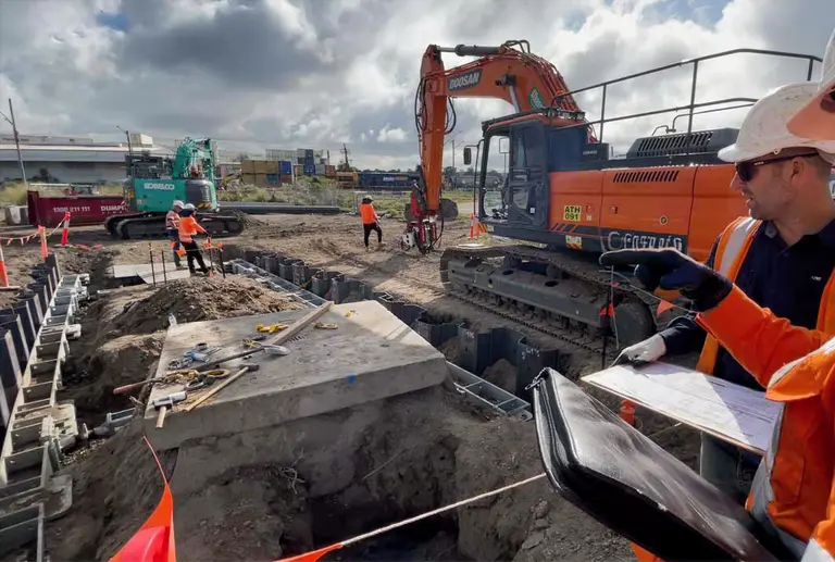 United Rentals team on shoring site with digger providing engineering service