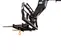Rear view of a black forklift crane hook attachment with prongs and an orange hook.