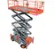 Side angled view of an orange and gray scissor lift, partially extended with safety railing.