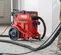 Red and black HILTI Concrete Dust Vacuum, Wet/Dry, Electric Powered