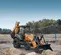 Orange and gray Case Backhoe Loader with 15 foot Dig Depth