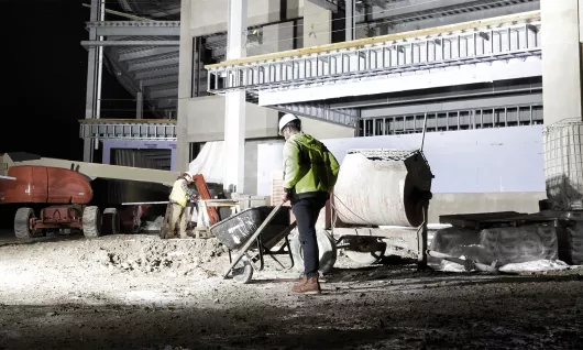 Light stand providing light on construction site