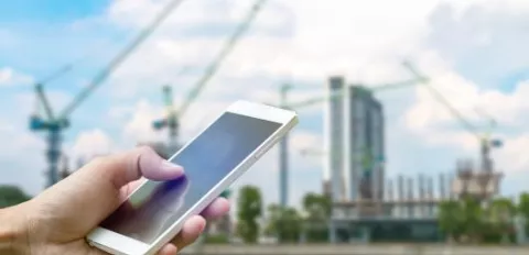 cell phone in front of worksite