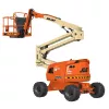 Side view of orange and beige JLG boom lift with extended boom and working platform.