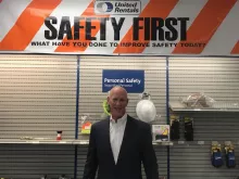 Kelly French (employee) in front of safety wall