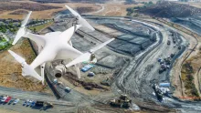 drone flying over jobsite