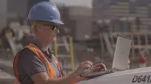 woman on jobsite with laptop