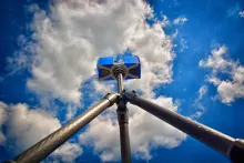 portable 3d laser scanner with blue sky and clouds
