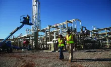 man and woman on jobsite in PPE