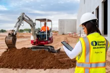 Workers onsite excavating dirt