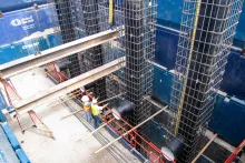 birdseye view of a trench jobsite with workers standing on composite matting