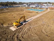 Installing mats on a jobsite