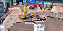 Timber mat supporting a crane at a jobsite