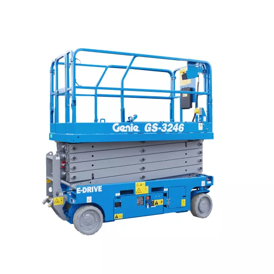 Side view of a retracted blue Genie scissor lift with guardrails.