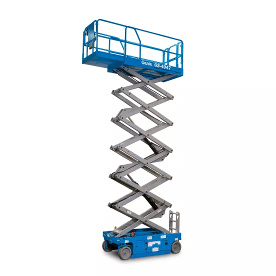 Front angled view of an extended blue Genie scissor lift with guardrails.